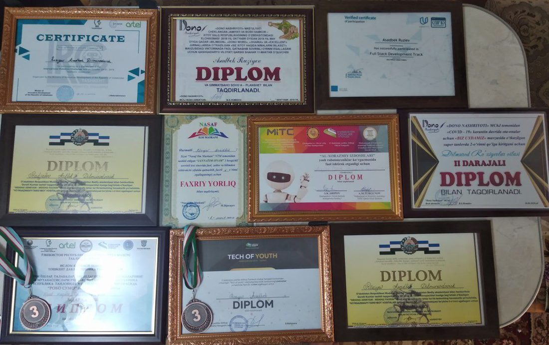 Wall of framed diplomas and certificates